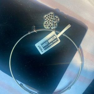 Woman’s Harley bracelet with dog paw on it